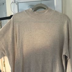 Soft Lightweight Never Worn Oversized High Neck Cozy Top, Cozy Oversized High Neck Top, Cozy Neutral Tops For Layering, Beige Turtleneck Top With Relaxed Fit, Casual Cream High Neck Top, Oversized Beige Turtleneck Top, Cream Funnel Neck Top For Fall, Casual Beige High Neck Top, Cozy Beige Turtleneck Top