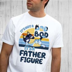 Introducing the ultimate collection of shirts dedicated to all the amazing fathers out there! Our “It’s Not A Dad Bod White Shirt With Funny Print For Father's Day, Father's Day Blue Top With Custom Print, Funny Blue Top With Custom Print, Blue Custom Print Top For Father's Day, Funny Blue Tops With Custom Print, Funny Blue Shirt With Relaxed Fit, Father's Day Blue Short Sleeve Tops, Casual Blue Shirt For Father's Day, Father's Day Blue Top With Funny Text