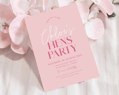 a pink party card with flowers on the side and text that reads ahoh's hens party