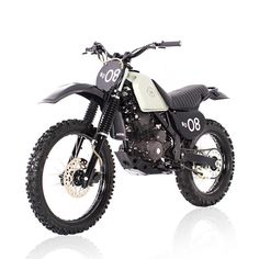 a black and white dirt bike on a white background