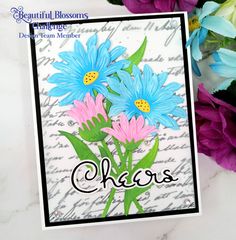 a card with blue and pink flowers on it