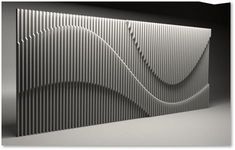 an abstract black and white photo with wavy lines on the back side of a wall