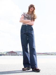 Asta features a high waist and a loose fit, accentuated with patch-on pockets. Crafted with precision akin to simplistic workwear, these pants strike a bold yet refined balance. The denims deep blue tone embodies the legacy of pure indigo-dyed 'redcast' denim. Its yarn's slubbiness and irregularity harken back to denim from the early 20th century, offering a contemporary twist that pays homage to vintage styles, relevant for today and destined to become tomorrow's vintage.    The pants' rinsed t Jeans Store, Workwear Pants, Boiler Suit, Blue Tone, Cotton Jeans, Loose Fit Jeans, Denim Collection, Nudie Jeans, Denim Details