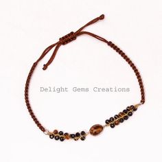 PRODUCT DETAIL :ITEM :  TIGER EYE AND BLACK SPINEL BEADED BRACELETITEM CODE :  DGC2552ITEM NAME :BRACELETGEMSTONE :  TIGER EYE AND BLACK SPINELBEADS SHAPE :   FACETED ROUNDLENGTH :   ADJUSTABLEBEADS SIZE: 3 MM APPROXWEIGHT :  58 Cts. APPROXCUSTOMIZATION/BULK ORDER : AVAILABLEPLEASE FEEL FREE TO CONTACT IF YOU REQUIRE ANY FURTHER INFORMATION. Adjustable Brown Beaded Bracelets With Black Beads, Adjustable Brown Jewelry With Black Beads, Brown Beaded Spiritual Friendship Bracelets, Brown Hand-strung Friendship Bracelets With Round Beads, Brown Friendship Bracelets With Round Hand-strung Beads, Spiritual Brown Beaded Friendship Bracelets, Adjustable Hand Wrapped Brown Beads, Brown Friendship Bracelets With Tiny Round Beads, Adjustable Brown Beaded Bracelet With Gemstone Beads