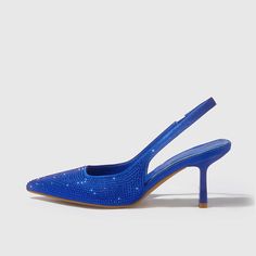 A perfect blend of elegance and style. These pointed slingback pumps feature stunning royal blue satin adorned with shimmering rhinestones, adding an exquisite touch to your ensemble. The manageable heel offers comfortable wear, making them ideal for any classy party or event. The secure slingback strap ensures a perfect fit, while the pointed-toe design lends a timeless appeal. These shoes are not just footwear, but a statement piece that can elevate any outfit, bringing sophistication and glam Blue Pointed Toe Slingback Pumps For Party, Elegant Blue Slingback Pumps For Party, Rhinestone Slingback Pumps For Prom, Embellished Slingback Pumps For Prom, Royal Blue Pointed Toe Heels For Evening, Elegant Royal Blue Heels For Evening, Elegant Royal Blue Evening Heels, Blue Pumps Heels, Royal Blue Pumps