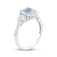 This glimmering aquamarine ring makes an unforgettable gift for your special occasion. Sterling silver A cushion-cut aquamarine is flanked by trillion-cut white lab-created sapphires Bezel-set round aquamarines shimmer on the sides of the setting Round-cut white lab-created sapphires line the tapered shank Fine Jewelry Asscher-cut Topaz Ring With Diamond, Classic Light Blue Diamond Ring, Aquamarine Diamond Ring For Promise, Aquamarine Promise Ring With Diamond Accents, Elegant Light Blue Brilliant Cut Ring, Elegant Aquamarine Ring With Ethical Diamonds, Aquamarine Three-stone Wedding Rings, Modern Aquamarine Ring For Wedding, Wedding Cushion Cut Blue Topaz Rings