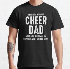 a man wearing a black t - shirt that says, yeah i'm a proud cheer dad much like a normal dad but with a lot of less money