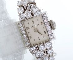 "This gorgeous vintage 1940's Hamilton watch showcases a lively display of a varying diamond cuts in a swirly pattern surrounding the dial and then all around the bracelet band. A total of 3.11 carats of smashing vintage beauty! Created in both platinum and 14k white gold. This special watch is ready for its second debut with you! Vintage Watch - Vintage Platinum & 14k White Gold 3.11ctw Diamond Ladies Watch 1940's Platinum & 14k White Gold 8 Baguette Diamonds =.40ct 34 Round Brilliant D Swirly Pattern, Antique Wedding Bands, Hamilton Watch, Watch Jewelry, Rosecut Diamond Ring, Antique Wedding, Antique Watches, Baguette Diamonds, Watch Vintage