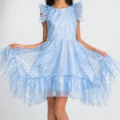 New! Modern Beautiful Tulle Dress Accented With Allover Silver Flecks Round Neckline Sleeveless Ruffle Trim High Low Hem Fit-And-Flare Silhouette Back Zip Closure Polyester, Self/Lining Hand Wash Made In Usa From Imported Materials Blue Sequin Dress For Dress-up, Light Blue Sleeveless Princess Dress For Party, Sleeveless Sequin Dress For Dress-up, Cute Flutter Sleeve Party Dress, Cute Party Dress With Flutter Sleeves, Cute Flutter Sleeve Dress For Party, Light Blue Sleeveless Princess Dress For Summer, Light Blue Sequin Dresses For Spring, Light Blue Sequined Dress For Spring