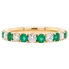 The green emerald and white diamond ring is a lovely band for a wedding band, anniversary band or a stackable band. The 14 karat yellow gold band is really excellent quality and is something that will be cherished forever. The details for this beautiful ring are listed below: Metal Quality: 14k Yellow Gold Diamond Number: 5 Diamond Shape: Round Average Diamond Diameter: 2.75 millimeters Diamond Carat Weight: .34 Carats Diamond Clarity: VS2 (Excellent, Eye Clean) Diamond Color: G (Excellent, Near Colorless) Gemstone: Emerald Emerald Gemstone Number: 6 Gemstone Shape: Round Average Gemstone Diameter: About 1.75 millimeters Gemstone Color: Green Gemstone Weight: .40 Carats Band Width: 2.85 millimeters Ring Size: 7 (Can be sized) Total Carat Weight: .74 Carats Emeralds and Diamonds Emerald And Diamond Ring Eternity Bands, Emerald And Diamond Eternity Band, Emerald And Diamond Band, Wedding Ring Green, Yellow Gold Diamond Wedding Band, Emerald Band Ring, Emerald Wedding Band, Smaragd Ring, Emerald Band