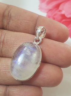 "Rainbow Moonstone Pendant Handmade Pendant Solitaire Pendant Boho Pendant Round Pendant 10X16mm Pendant Moonstone Pendant For Women's    ABOUT~ PENDANT ✦Type : Handmade item ✦Materials: 925 Sterling Silver  ✦Gemstone: Rainbow Moonstone  ✦Stone Size: 10.00X16.00mm ✦Setting : Bezel Setting ✦Product Weight : 5.15gm (Approx)  ~O U R Q U A L I TY ~ ✦Best Quality  ✦Made By 925 Sterling Silver ~ABOUT GEMSTONE ~  A stone for \"new beginnings\", Moonstone is a stone of inner growth and strength. It soothes emotional instability and stress, and stabilises the emotions, providing calmness. Moonstone enhances intuition, promotes inspiration, success and good fortune in love and business matters. ~C U S T O M I Z E O R D E R~ We accept custom and personalized order.  Please send us message if you are Healing White Moon Phase Jewelry, White Gemstone Pendant Jewelry, Silver Moonstone Pendant Gemstones, White Moonstone Round Jewelry, White Gemstone Oval Pendant Jewelry, Moonstone Round Pendant Jewelry For Gift, White Moonstone Jewelry With Moon Charm, White Round Pendant Jewelry With Large Stone, White Moonstone Cabochon Jewelry