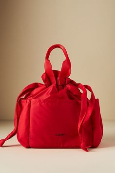 a red bag sitting on top of a white table