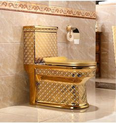 a gold toilet sitting on top of a tiled floor