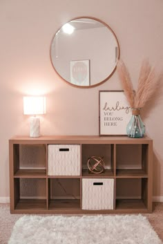 a living room with a mirror and some drawers