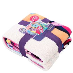 the little pony blanket is folded up on top of each other