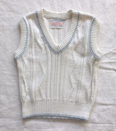 FRENCH VINTAGE 70's, very cute little white vest / sleeveless sweater, V-neck, acrylic and cotton ( 30 % ) knit. Size 6 months Vintage condition level 5, new old stock ( washed once ) We assess the condition of our vintage items on a scale from 0 to 5. Level 5 corresponds to an almost new vintage condition. Any defects are systematically reported. Even though in very good condition, vintage items may present imperfections due to their age, which mainly adds to their charm. I am fond of children White Knit V-neck Vest, Vintage White V-neck Top, White Knitted V-neck Sweater Vest, White Sleeveless Knit Sweater, Fitted White Cotton Sweater Vest, Vintage V-neck Knitted Tops, White Fitted Retro Sweater Vest, White Knitted Vest For Spring, Fitted Sleeveless White Sweater