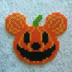 an orange beaded mickey mouse pumpkin