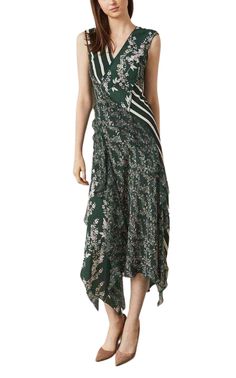 This sleeveless A-line dress in a romantic floral print is embellished with bold stripes, airy flounce, and a flowing asymmetrical hemline. “Stream of Bloom” print Fabric Self and Contrast 3: 100% polyester crepe; Contrast 1: 100% polyester floral georgette; Contrast 2: 100% polyester striped crepe; Lining: 100% polyester stretch crepe de chine Machine wash Imported Floral Print Dress With Asymmetrical Hem For Garden Party, Chic Floral Print Dress With Asymmetrical Hem, Chic Asymmetrical Hem Floral Print Dress, Elegant Sleeveless Asymmetrical Dress With Floral Print, Spring Floral Print Sleeveless Asymmetrical Dress, Spring Asymmetrical Sleeveless Dress With Floral Print, Sleeveless Asymmetrical Floral Dress For Spring, Chic Sleeveless Silk Floral Dress, Spring Silk Dress With Asymmetrical Hem