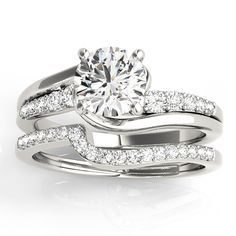 a white gold diamond ring and matching wedding band with an engagement ring in the center