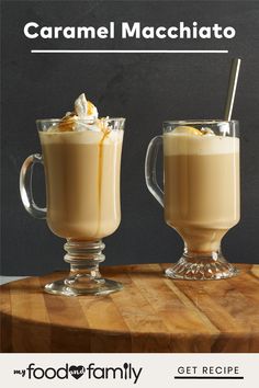 two glasses filled with food sitting on top of a wooden table next to each other