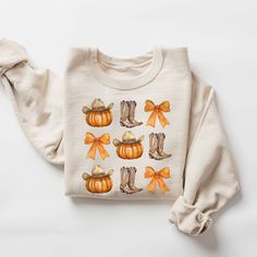 Howdy Pumpkin Sweatshirt, Fall Sweatshirts, Cowgirl Crewneck, Pumpkin Coquette Bow Tee, Country Fall Hoodie, Western Fall Sweater HOW TO ORDER 1. Check our photos for color and sizing options.  2. Choose your quantity. 3. Select your size and color from the drop-down menus. 4. Click "ADD TO CART" to add the shirt to your virtual cart.  5. Click "PROCEED TO CHECKOUT" to purchase your shirt.  6. Your shirt is now off to production! We will process your order and your shirt will be ready to ship in 1-3 days! PRODUCTION and SHIPPING - Production: 1-3 business days - Standard Shipping (3-5 business days after production time, please consider the pandemic and delivery time might take longer than usual time, if you are in a rush please upgrade the shipping at checkout) - Available Upgrade for Exp Cute Cozy Fit Tops For Fall, Cute Fall Hoodie, Cute Fall Sweater With Ribbed Cuffs, Cute Sweater With Ribbed Cuffs For Fall, Cute Relaxed Fit Sweatshirt For Fall, Fall White Soft-washed Sweatshirt, Soft-washed White Sweatshirt For Fall, Cute Long Sleeve Fall Sweatshirt, Cute Long Sleeve Sweatshirt For Fall