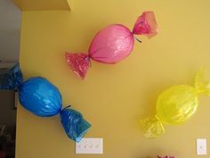 some candy bags are hanging on the wall