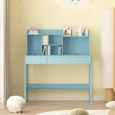 a child's bedroom with a blue desk and toy sheep on the floor next to it