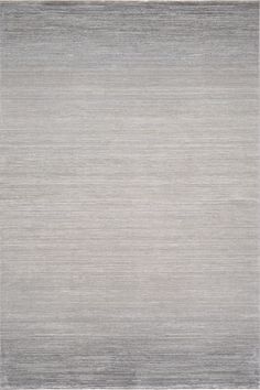 an area rug with grey and white stripes