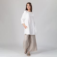 "Slow fashion short linen tunic dress with 3/4 raglan sleeves and concealed side pockets. Versatile design, perfect on its own as a mini dress or paired with your favorite jeans or pants as a tunic. Gentle A-line silhouette and an loose cut for a relaxed and comfortable feel. Shown here in Snow White 250 gsm medium weight linen. SIZING: To choose the right size, check out our body measurements chart displayed in the product listing photos. If you need specific sizing recommendations, please don' Daywear Linen Dress With 3/4 Sleeves, Linen Dress With 3/4 Sleeves For Daywear, Linen Dress With Relaxed Fit And 3/4 Sleeves, Relaxed Fit Linen Dress With 3/4 Sleeve, Body Measurements Chart, Short Linen Dress, Flared Mini Dress, Measurements Chart, Body Measurement Chart