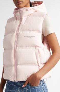 A simple, silvery brand logo on the chest provides the only—and thus instantly noticed—detailing on this cropped down puffer vest with an always-available and easily adjustable insulated hood. 22" length (size Medium) Front zip closure Stand collar; drawcord-toggle hood Front welt pockets; interior zip pockets Drawcord-toggle hem Lined, with 75% down, 25% feather fill 88% polyester, 12% elastane Dry clean Made in China Designer Clothing Puffer Vest, Welt Pockets, Alexander Wang, Welt Pocket, Stand Collar, Brand Logo, Zip Pockets, Light Pink, Designer Clothing