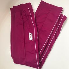 New Without Tags...Purchased Last Year But Never Worn. Beautiful Color Nike Straight Leg Track Pants. Polyester Material, Attractive Modern Fit. Size Small. Nike Pink Pants For Loungewear, Nike Pink Lounge Pants, Nike Pink Loungewear Pants, Nike Track Pants, Nike Pants, Modern Fit, Polyester Material, Track Pants, Pant Jumpsuit