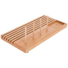 a wooden tray with four forks on it