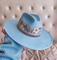 "Handmade item Premium Quality We are happy to present our premium suede collection/SPECIAL EDITION \"GIANNA\" in baby blue color. You are going to fall in LOVE with every detail. Handmade Made in Mexico Vegan Suede Premium Suede Baby blue Color Large brim Wide brim 3.5 inches Size: XS/S/M (53cm - 57cm) M/L/XL (57cm - 60cm) MUST HAVE! Beautiful handmade hats perfect to wear for any occasion! Be it a graduation party, a night out in the city or a fun sun-filled day at the beach!" Decorated Fedora Hats, Custom Cowgirl Hats, Embellished Cowboy Hat, Cowboy Hat Design, Custom Cowboy Hats, Handmade Hats, Painted Hats, Women Hats Fashion, Sky Blue Color