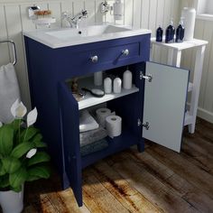 a bathroom with a blue cabinet and sink