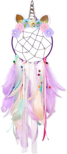 a white and purple dream catcher with feathers