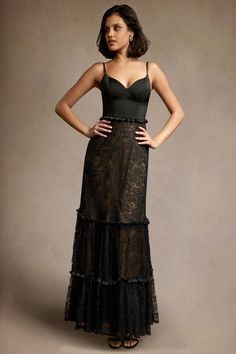 Our Jennifer Ruffle Maxi Dress is the perfect dress for evening events. This style includes a beautiful sweetheart neckline crafted from satin paired with an A-line lace ruffle skirt. Wear this beauty to your next formal night out or a wedding reception. Black Lace Ruffle Dress, Elegant Lace Dress With Ruffles And Fitted Bodice, Satin Corset Dress With Ruffles For Evening, Evening Satin Corset Dress With Ruffles, Elegant Ruffled Corset Dress For Prom, Elegant Ruffled Corset Dress For Prom Season, Formal Evening Dress With Lace Bodice And Spaghetti Straps, Elegant Evening Dresses With Ruffled Straps, Elegant Fitted Lace Dress With Lined Bodice