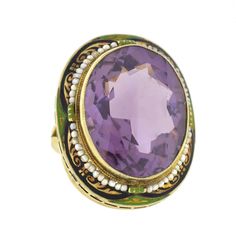 An exquisite amethyst ring from the Art Deco (ca1920) era! Made of 14kt yellow gold, this fabulous piece holds a large, faceted, oval shaped amethyst stone at its center. The bezel set stone has a faceted face and back and exhibits a vibrant, purple color. Surrounding the stone is a twisted yellow gold wire frame along with a natural seed pearl border and a colorful enameled frame encircles the entire piece. The green and black enameled design is absoultey wonderful, completing the striking Deco White Gold Pearl Ring, Seed Pearl Ring, Emerald Ring Engagement Diamond, Pearl Amethyst, Filigree Ring Gold, Gold Pearl Ring, Vintage Cocktail Ring, Purple Amethyst Ring, Amethyst Gold