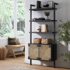 a book shelf with baskets and books on it next to a window in a living room