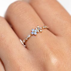 Take beauty wherever you go in the Blue Blossom Garden Ring. This design has become a GC favorite and is here to stay! You'll get lost in the stunning and calming baby blue and milky white cubic zirconia stones. Sky Blue Jewelry, Beautiful Earth Boutique, Cute Trendy Jewelry, Cute Rings For Teens, Cute Aesthetic Jewelry, Cute Engagement Ring, Pretty Rings Simple, Wedding Ring Flower, Light Blue Jewelry