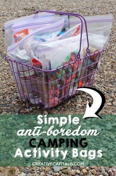 a basket filled with plastic bags sitting on top of a gravel covered ground next to another bag