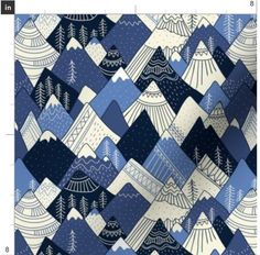 a blue and white fabric with mountains in the background