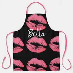 a black apron with pink lipstick printed on it and the word bella written in white