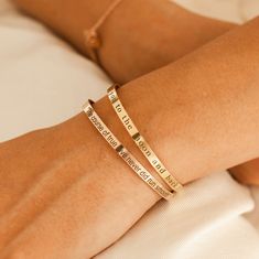 ❤️ Grab 3 fabulous items and enjoy a delightful 25% off when you use the code BUY3GET25 Elevate your style and touch loved one's heart with our Personalized Bangle Bracelets.  Engraved with a custom name or inspirational message, these gold plated bracelets make a perfect gift for your loved one. Express your love and admiration in a unique and elegant way with our meaningful and personalized bracelets. #YOU MAY ALSO LIKE Personalized Bracelet https://www.etsy.com/listing/527644356/personalized- Elegant Bangle Bracelet For Best Friend Gift, Rose Gold Bracelet For Mother's Day Best Friend Gift, Gold Stackable Name Bracelet For Friendship, Stackable Gold Name Bracelet For Friendship, Meaningful Gold Bracelet, Gold Name Bracelet For Mother's Day, Meaningful Gold Name Bracelet For Mother's Day, Meaningful Gold Bangle Jewelry, Meaningful Gold Bracelets For Mother's Day