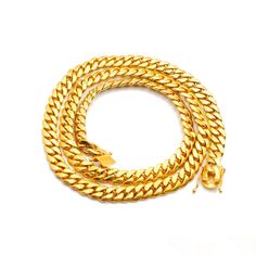 This is part of Chairish’s Costume Jewelry assortment.  Gender: Men's  Metal Type: 925 Sterling Silver & Gold Plated  Length: 34.00 Inches  Diameter: 10.90 mm   Weight: 246.00 Grams  One men gold plated silver cuban link chain. Engraved with "925". In new condition.  SKU: 141255 Yellow Gold Cuban Link Necklace Tarnish Resistant, Tarnish Resistant Yellow Gold Cuban Link Necklace, Classic Gold Cuban Link Necklace With Curb Chain, Luxury Yellow Gold Cuban Link Necklace Tarnish Resistant, Formal Gold Plated Cuban Link Necklace With Curb Chain, Formal Cuban Link Necklace With Curb Chain, Luxury Tarnish-resistant Yellow Gold Cuban Link Necklace, Luxury Yellow Gold Cuban Link Necklace, Cuban Link Curb Chain Necklace