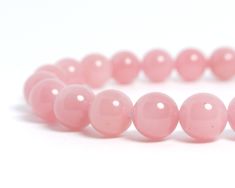 Guava quartz have rich pink color, its name come from tropical fruit guavas. Guava quartz is not transparent like rose quartz. Beads size: 8mm Color: Pink Quality: Small spots of black inclusions. This is rare round shape guava quartz. Photo: They are examples of bracelet you'll receive. Same color and quality of beads will be used. 3 PACKAGING STYLE - Bracelet only (light package with no pouch or box) - Jewelry pouch (you can store the bracelet when not in use) - Jewelry pouch & box (Ready Pink Polished Beads Bracelet, Pink Polished Beaded Bracelets, Pink Bracelets With Polished Beads, Pink Round Bracelets With Polished Beads, Keep Bracelet, Guavas, Rose Quartz Beads, Quartz Beads, Tropical Fruit