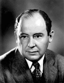 an old black and white photo of a man in a suit with a serious look on his face