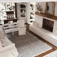 a living room filled with furniture and a fire place