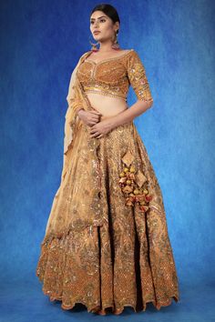 A beautiful rust-colored organza ensemble, adorned with intricate sequin threadwork, stonework, and cutdana. The exquisite craftsmanship is highlighted by the rich, textured fabric, making it a piece that stands out. WASH CARE INSTRUCTIONS - Please Dry clean only when it is applicable! Ready to Ship! Tissue Silk Lehenga With Cutdana For Reception, Organza Choli With Cutdana For Reception, Reception Lehenga In Tissue Silk With Cutdana, Reception Tissue Silk Sharara With Cutdana, Reception Organza Choli With Cutdana, Transitional Organza Lehenga With Cutdana, Transitional Organza Blouse With Intricate Embroidery, Transitional Lehenga With Intricate Embroidery In Tissue Silk, Transitional Tissue Silk Lehenga With Intricate Embroidery