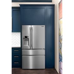 a stainless steel refrigerator with ice and water dispenser in a blue kitchen