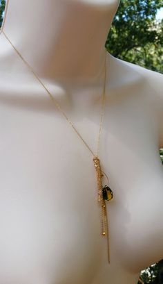 "I designed this necklace for Stassi based on the color and shape of the stone. Stassi loves the green and yellow colors in the quartz teardrop stone (12mm X 14mm). She wanted me to create a necklace based off her \"Boho\" style. This necklace can be made in sterling silver or 14k gold fill flat cable chain. The chains fall like a \"messy\" tassel, all different lengths. There are several citrine stones and 22k gold plated nuggets that are at the bottom of some of the chains. There are several s Green Teardrop Jewelry With Adjustable Chain, Green Teardrop Necklace With Adjustable Chain, Green Drop-shape Birthstone Necklace, Green Teardrop Gemstone Drop Necklace, Gold Teardrop Drop Necklace With Natural Stones, Citrine Stone, Yellow And Green, Green And Yellow, 22k Gold